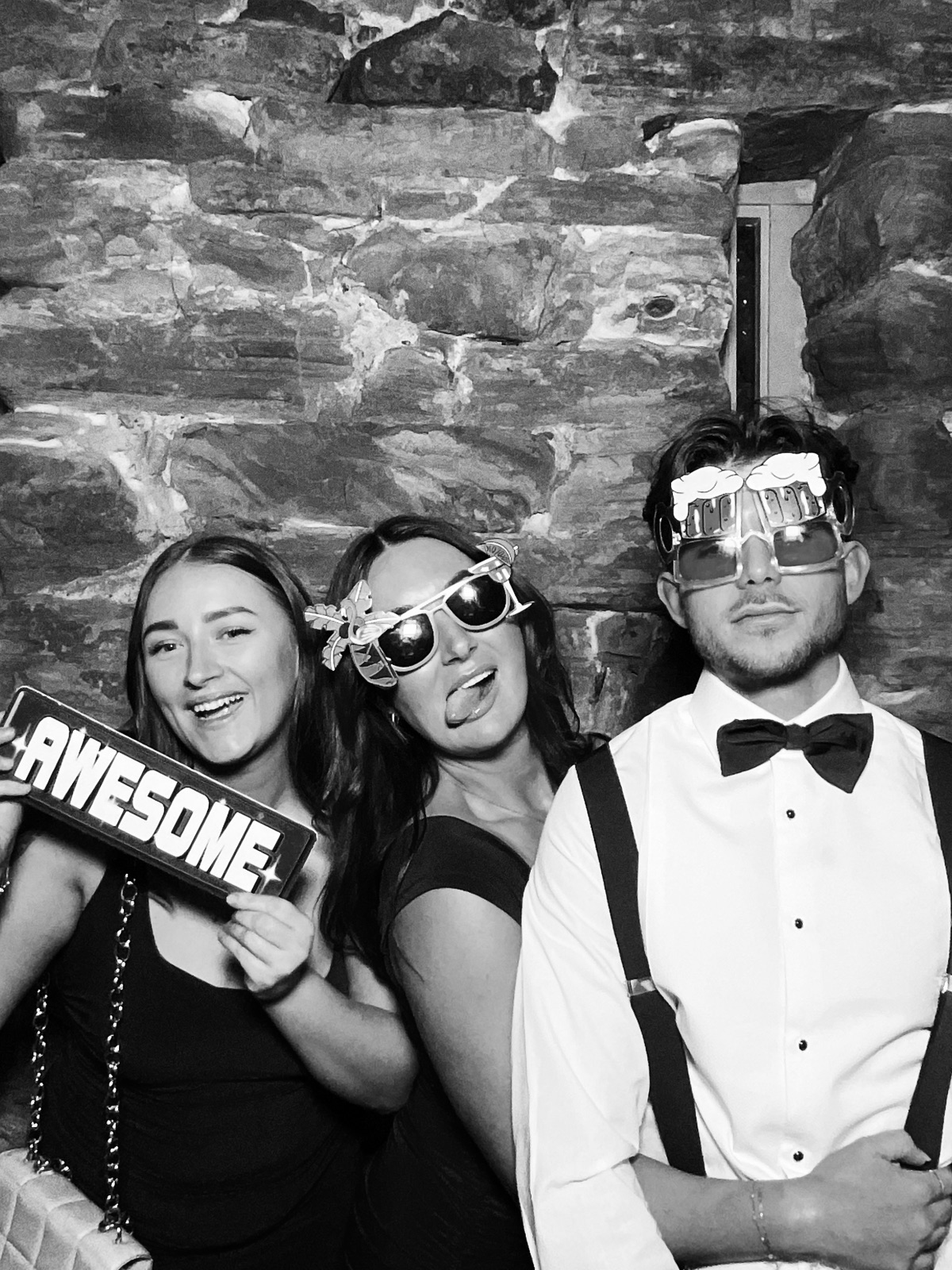 Friends having fun in the photo booth at a Carlisle birthday party